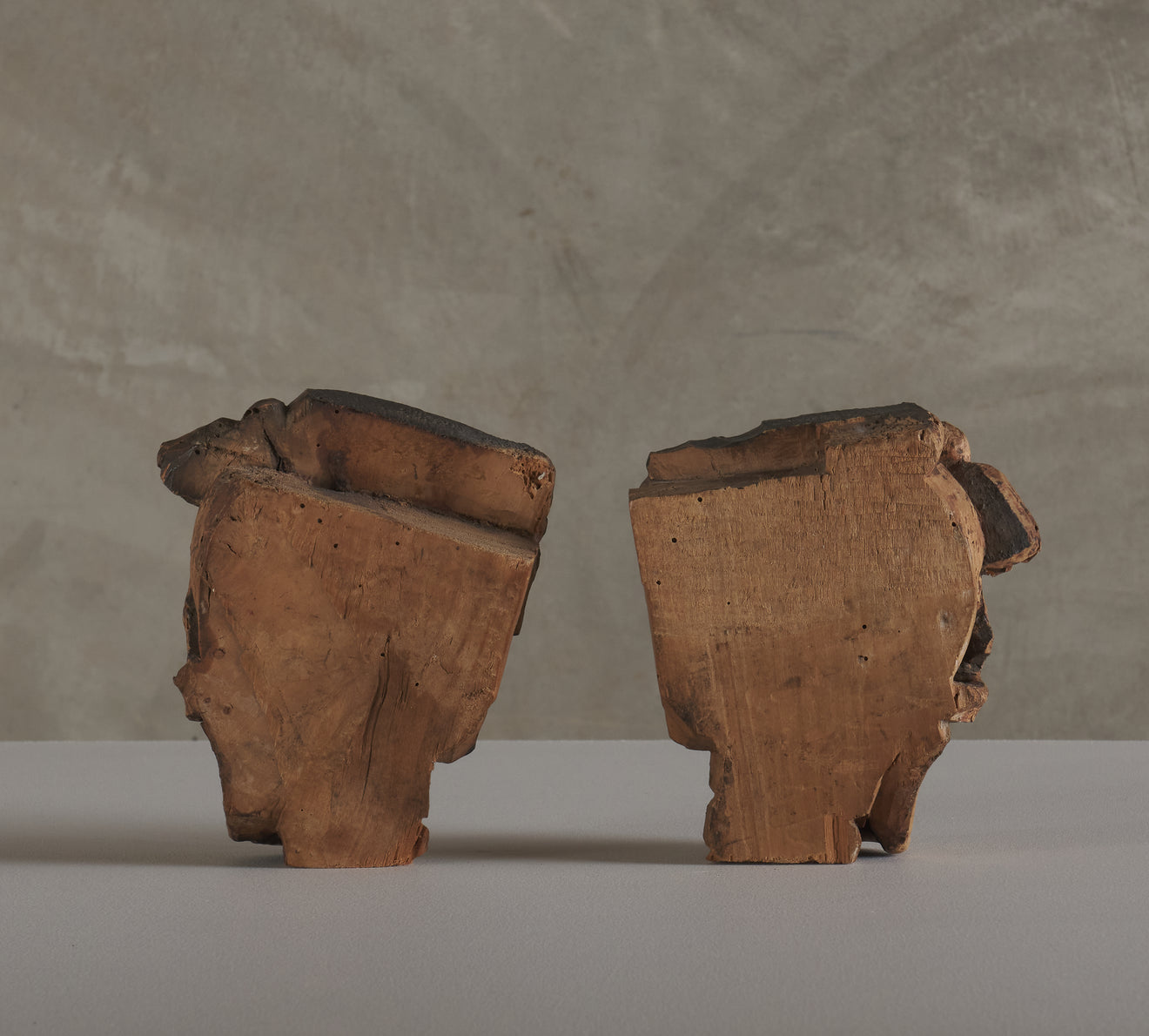 2 CARVED WOOD SKULL FORM ARCHITECTURAL ORNAMENTS