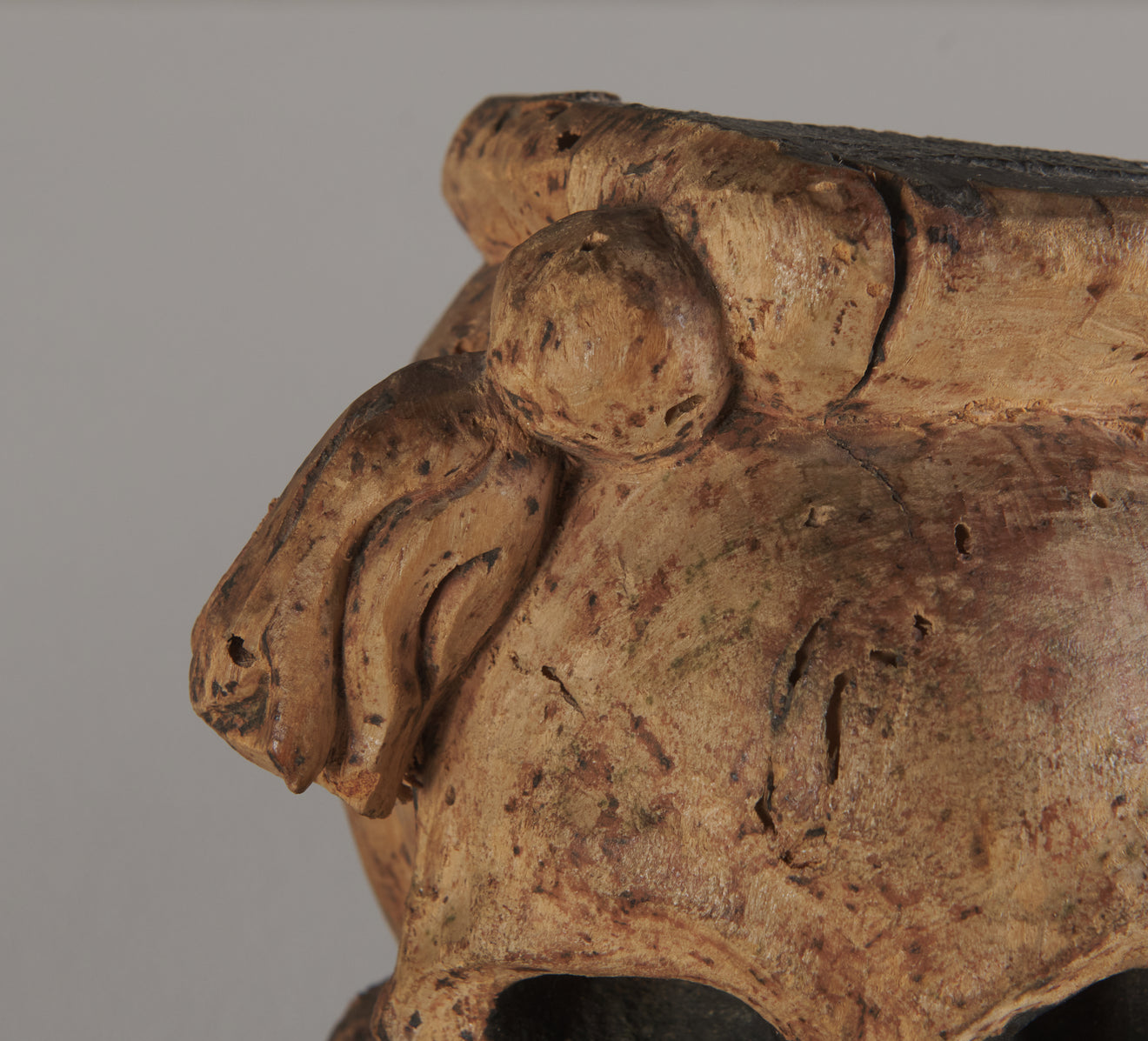 2 CARVED WOOD SKULL FORM ARCHITECTURAL ORNAMENTS