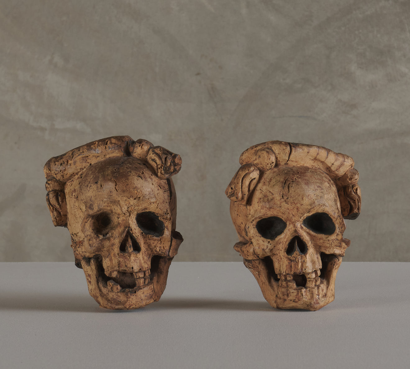 2 CARVED WOOD SKULL FORM ARCHITECTURAL ORNAMENTS