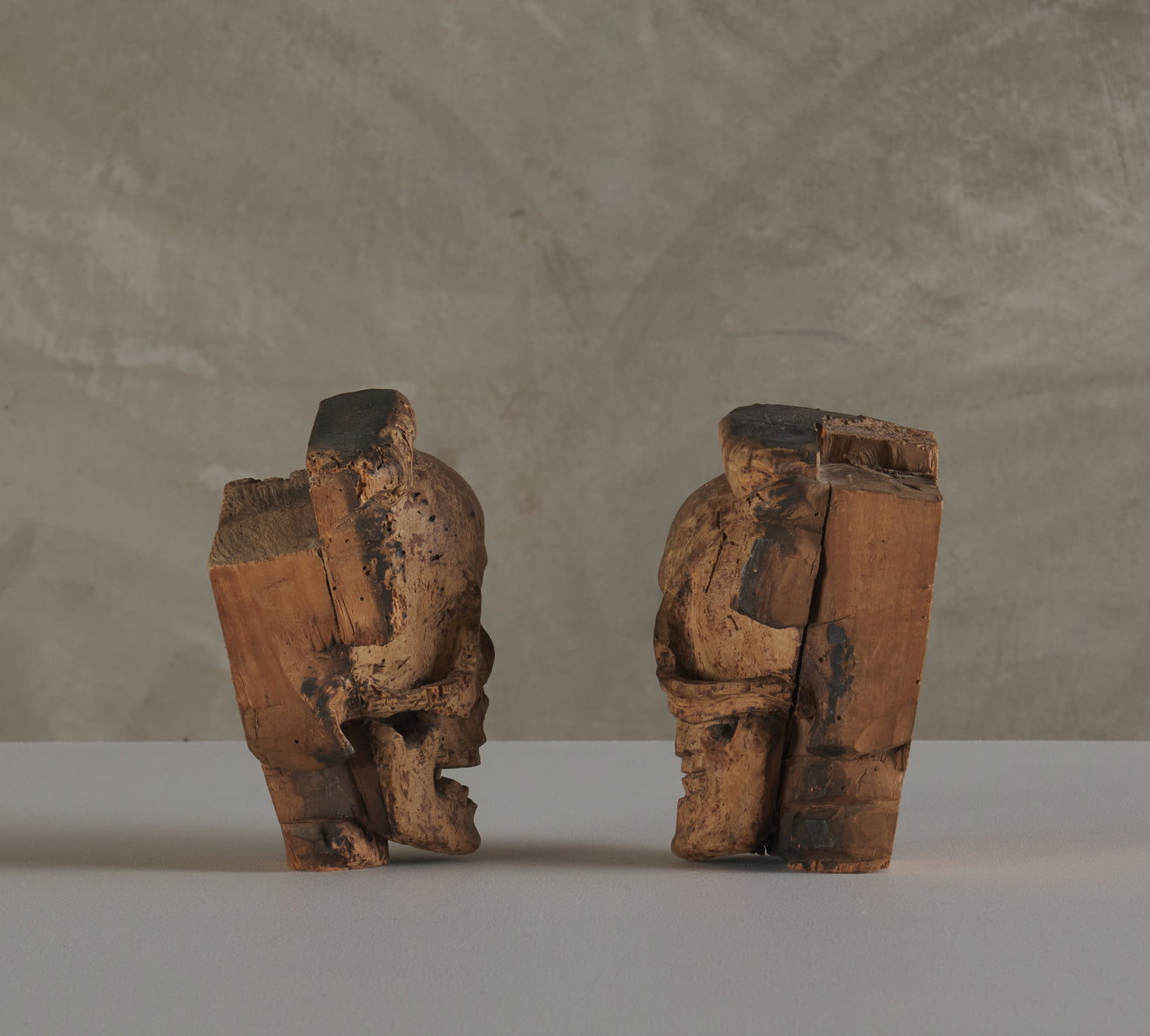 2 CARVED WOOD SKULL FORM ARCHITECTURAL ORNAMENTS