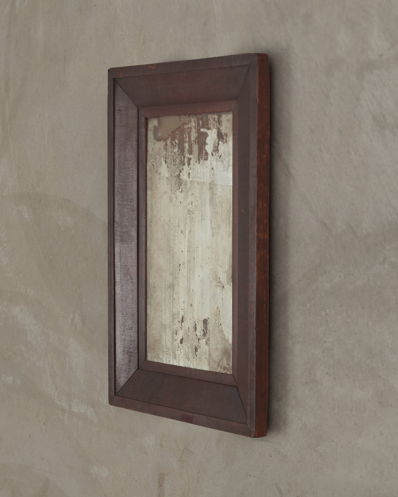 ANTIQUE WALL MIRROR IN THE EMPIRE STYLE