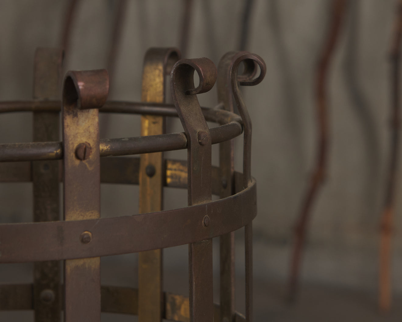 BRASS STRAPPED STAND WITH COLLECTION OF GNARLED WOOD WALKING STICKS