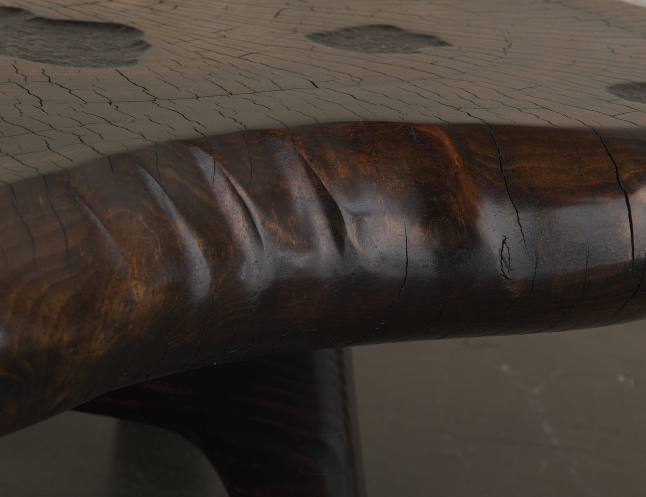 DARK COTTON WOOD COFFEE TABLE ON BASE BY DAN POLLOCK
