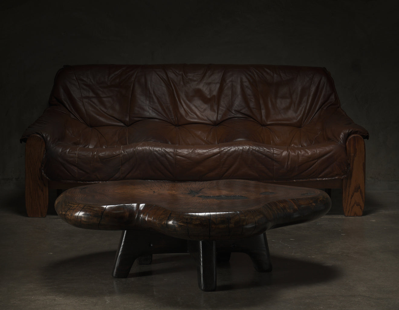 DARK COTTON WOOD COFFEE TABLE ON BASE BY DAN POLLOCK