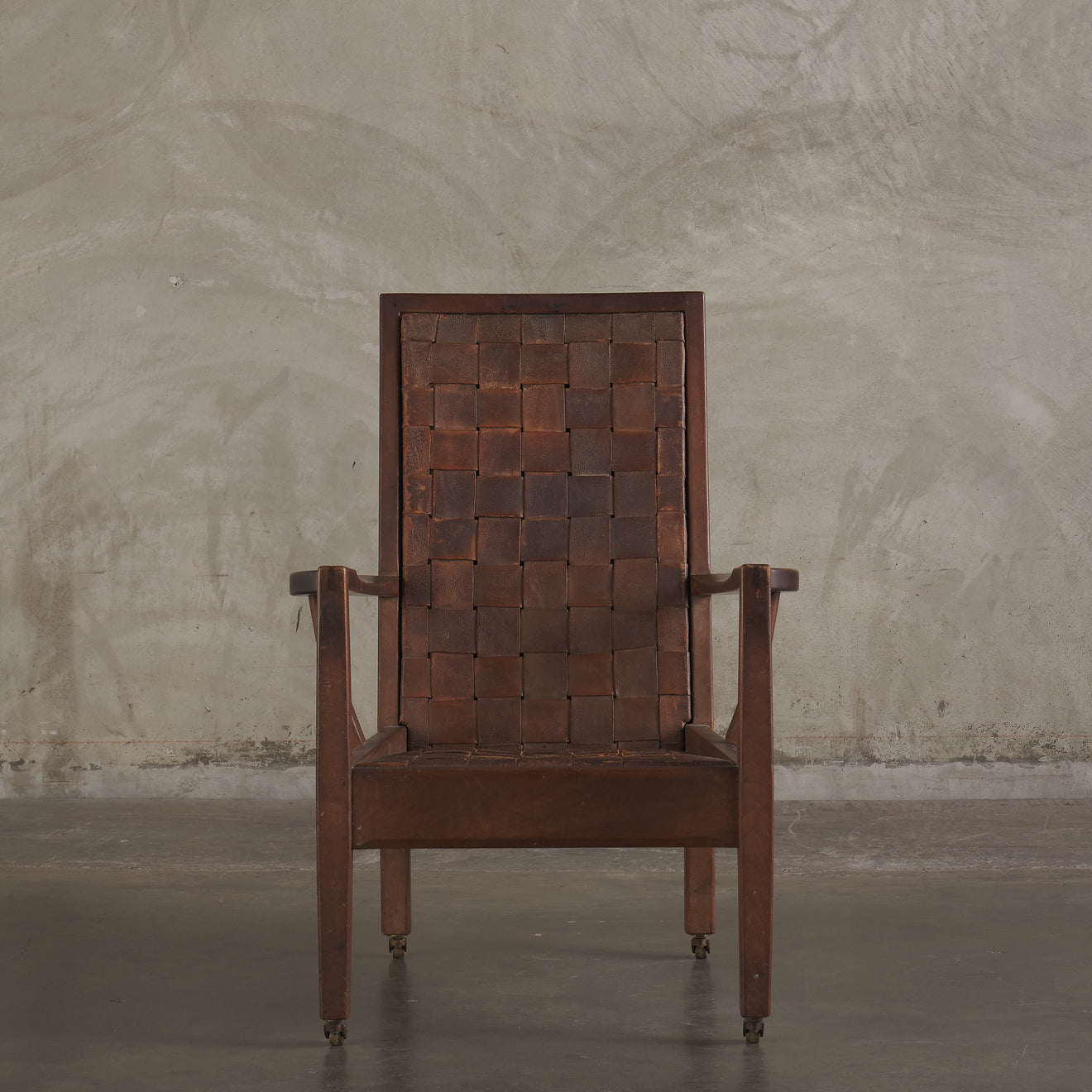 GORDON RUSSELL WOVEN LEATHER LOUNGE CHAIR, ENGLAND, EARLY 20TH CENTURY