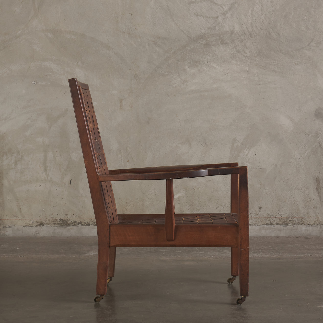 GORDON RUSSELL WOVEN LEATHER LOUNGE CHAIR, ENGLAND, EARLY 20TH CENTURY