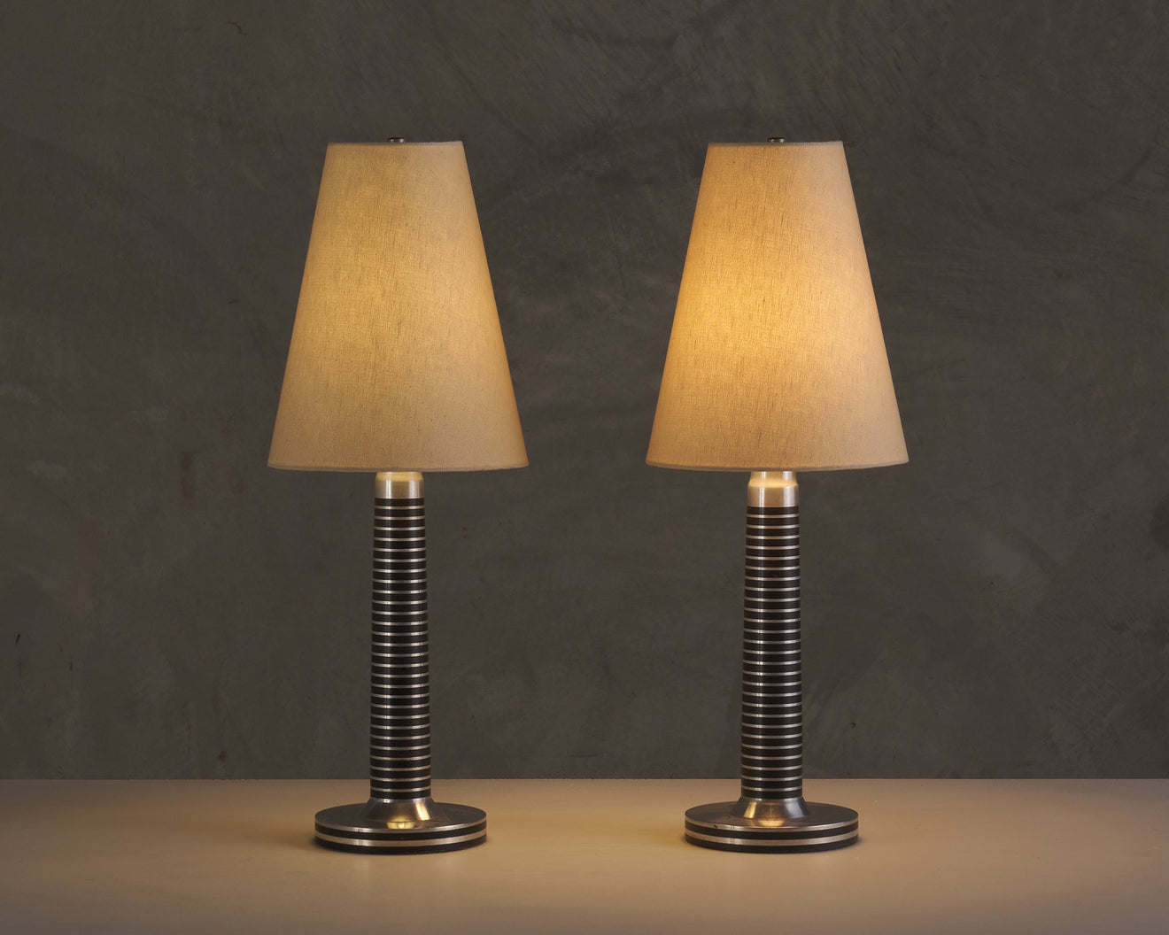 PAIR OF MACHINE AGE ALUMINUM LAMPS
