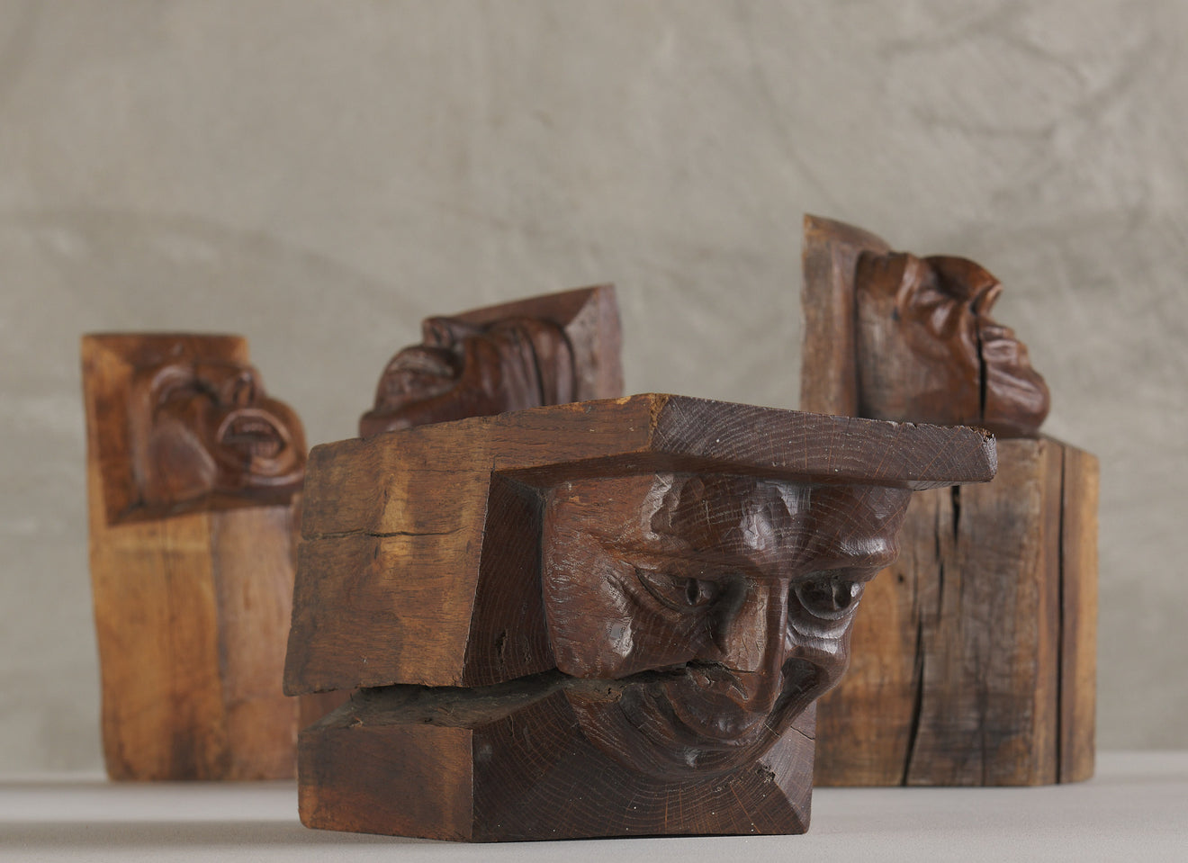 SET OF FOUR WOOD CARVED CORBELS WITH GROTESQUE FACES