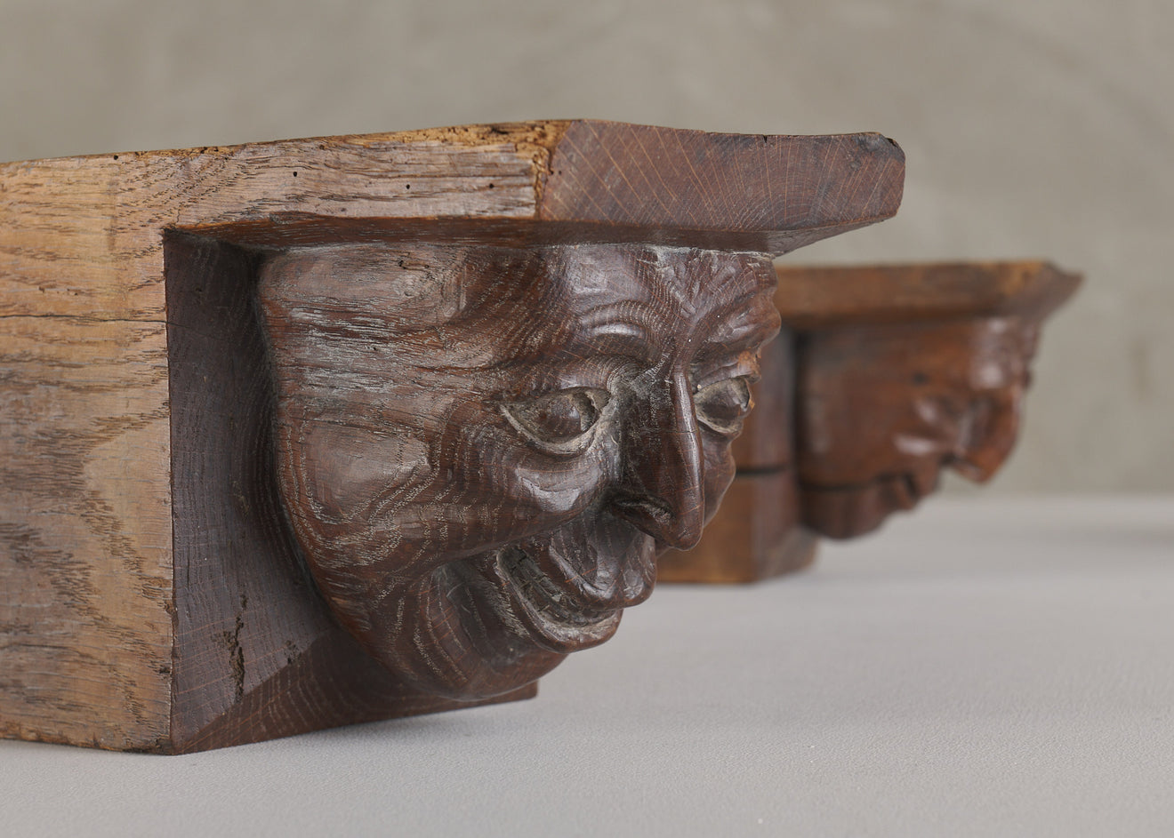 SET OF FOUR WOOD CARVED CORBELS WITH GROTESQUE FACES