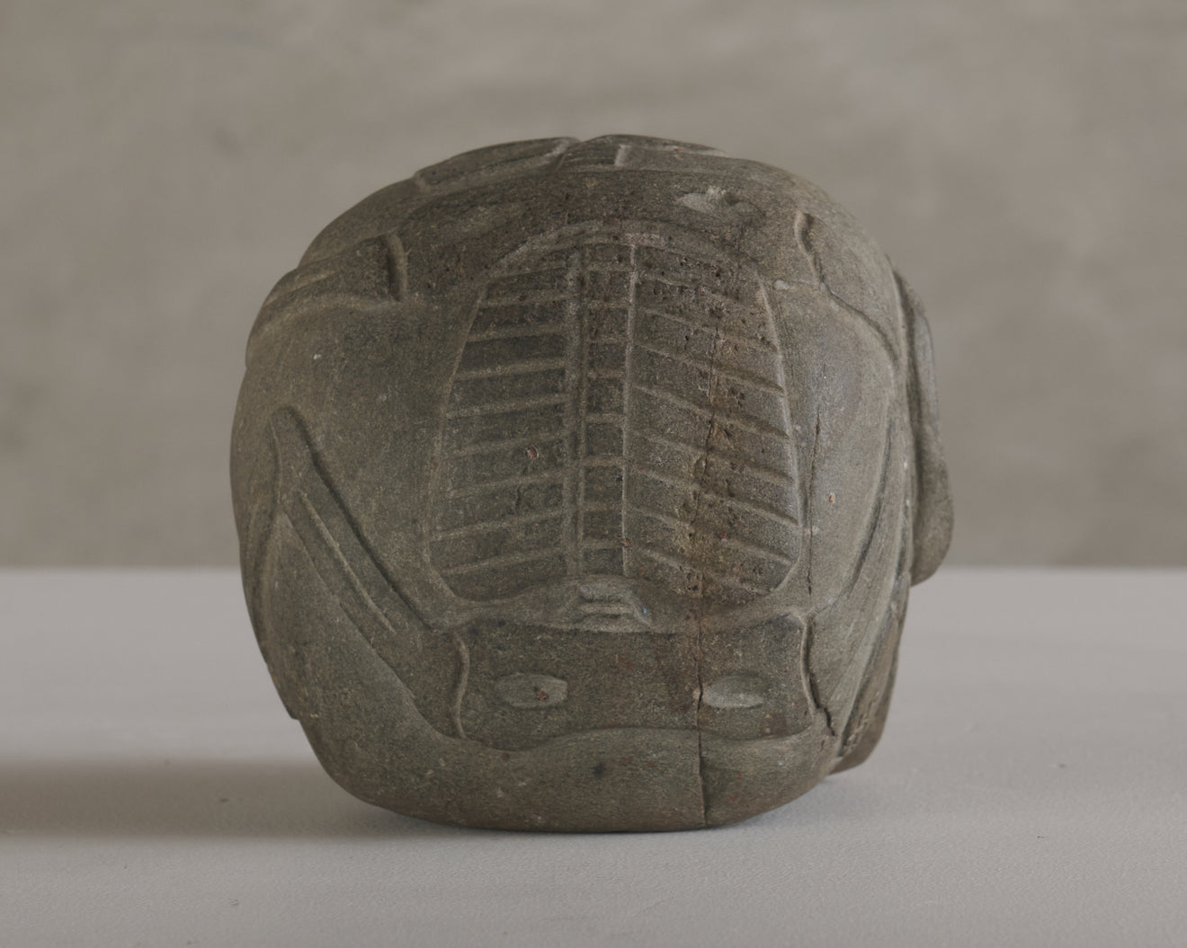 BASALT SKULL WITH CARVED SKELETON