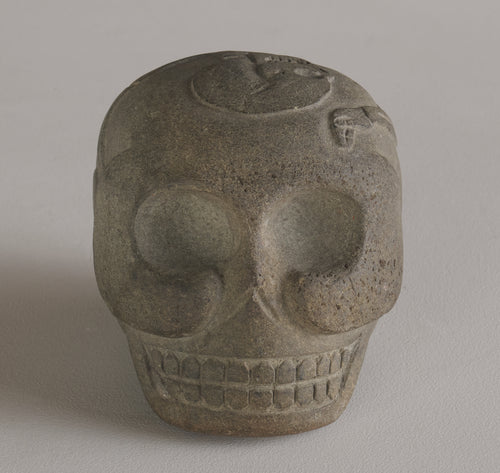BASALT SKULL WITH CARVED SKELETON