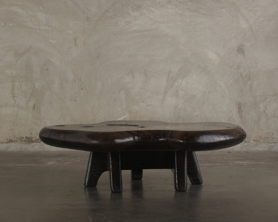 DARK COTTON WOOD COFFEE TABLE ON BASE BY DAN POLLOCK