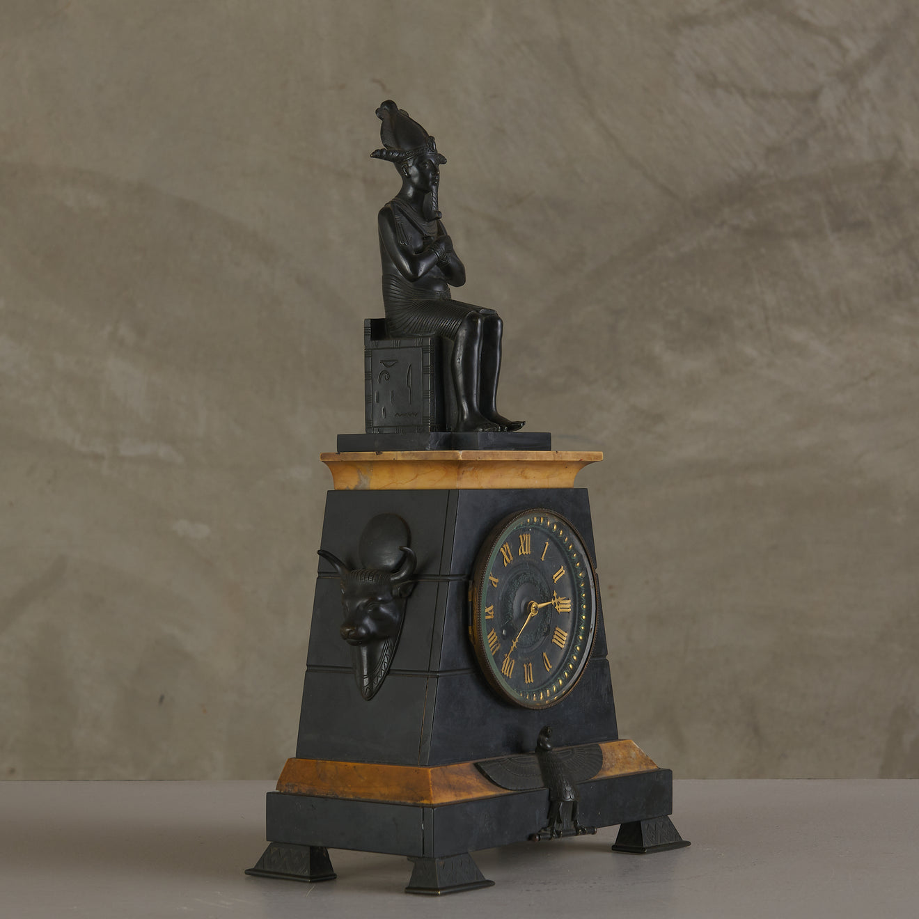 EGYPTIAN REVIVAL MARBLE CLOCK WITH TWO CANDELABRA GARNITURES