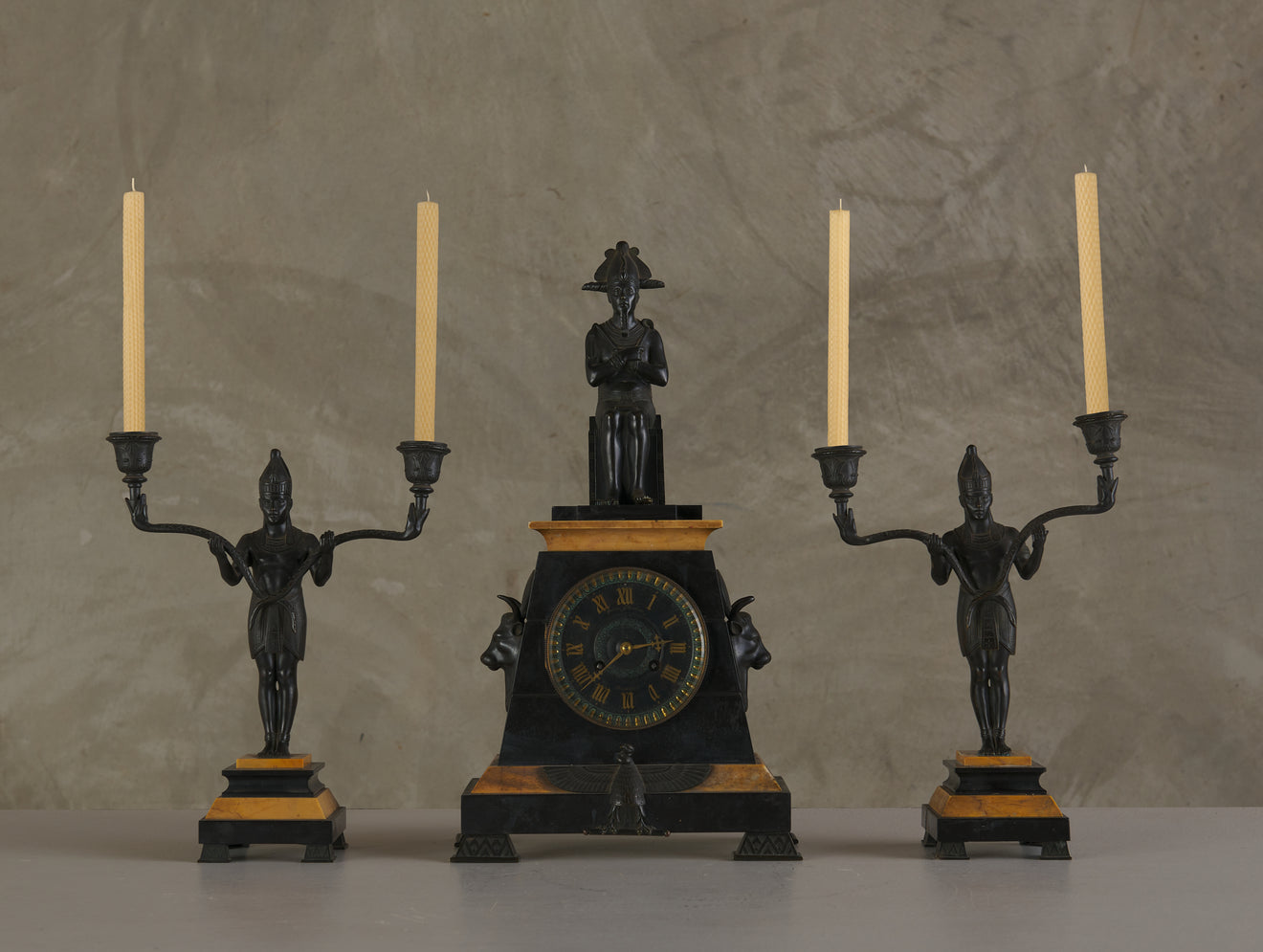 EGYPTIAN REVIVAL MARBLE CLOCK WITH TWO CANDELABRA GARNITURES