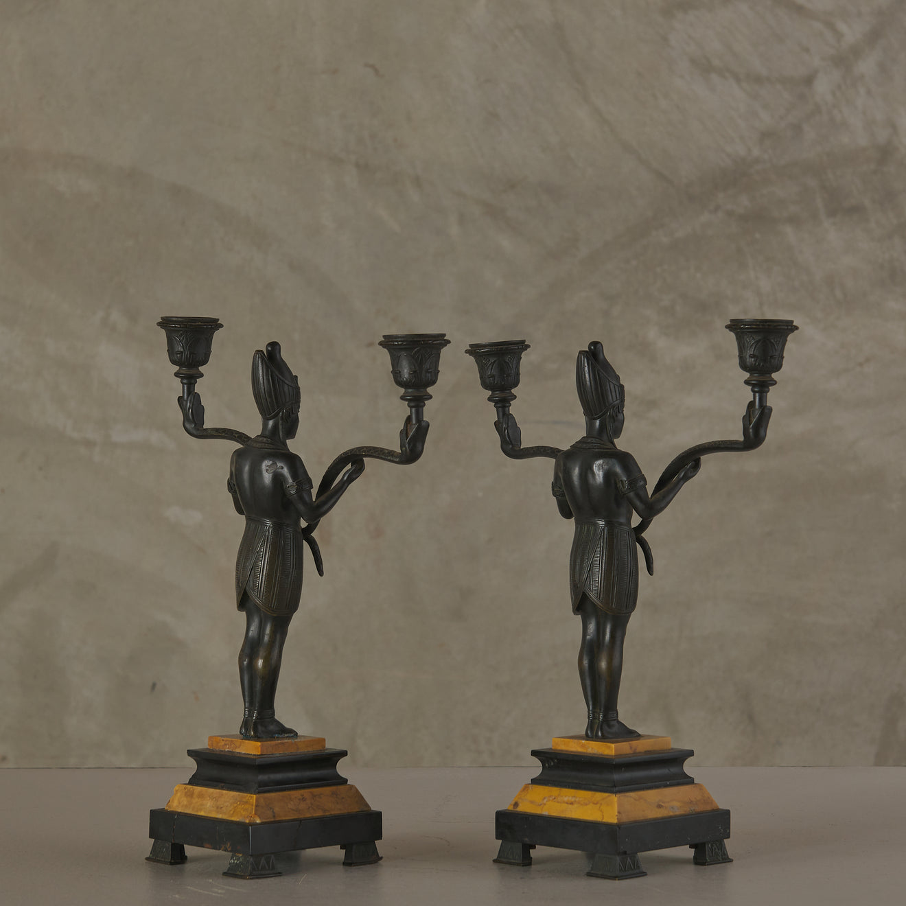 EGYPTIAN REVIVAL MARBLE CLOCK WITH TWO CANDELABRA GARNITURES