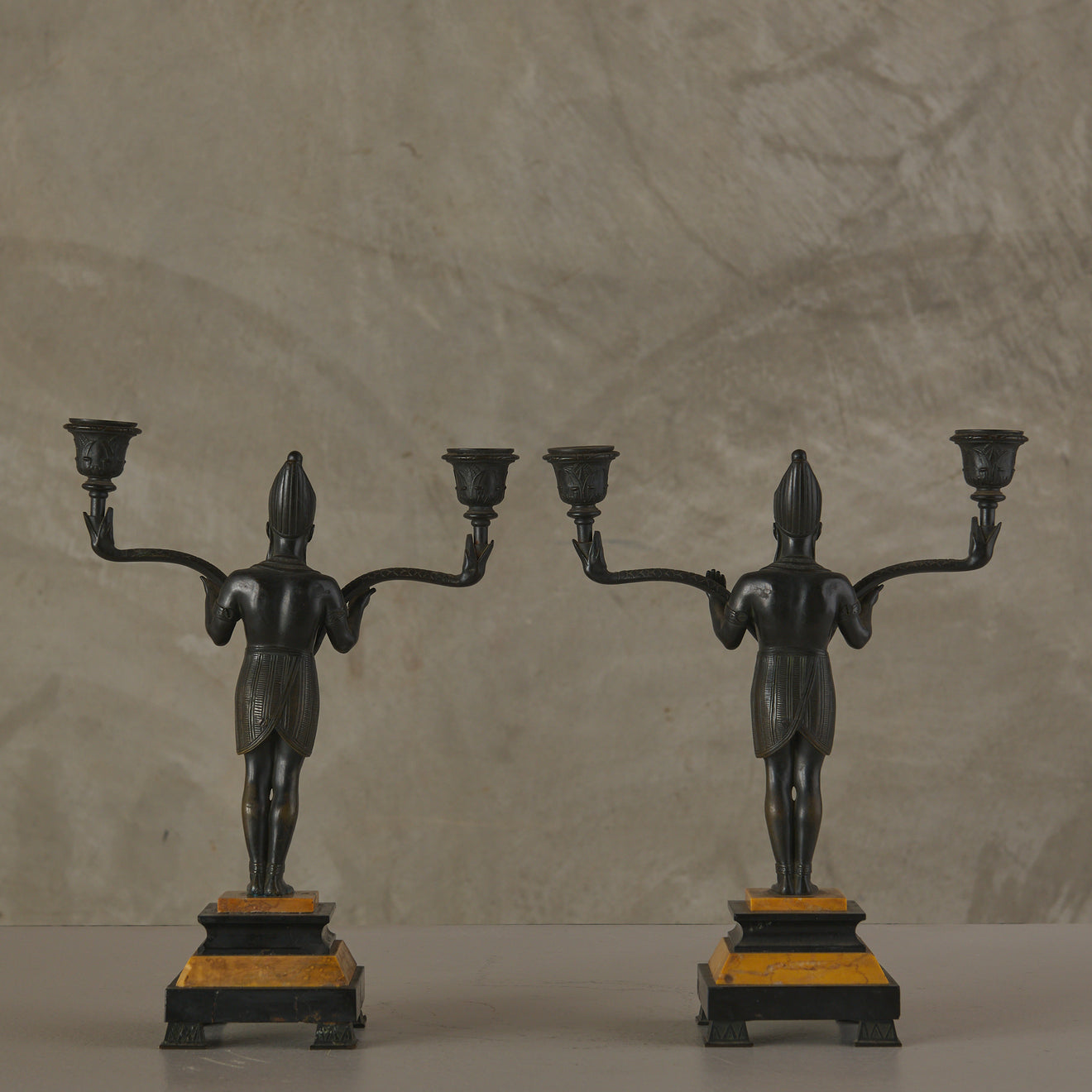 EGYPTIAN REVIVAL MARBLE CLOCK WITH TWO CANDELABRA GARNITURES