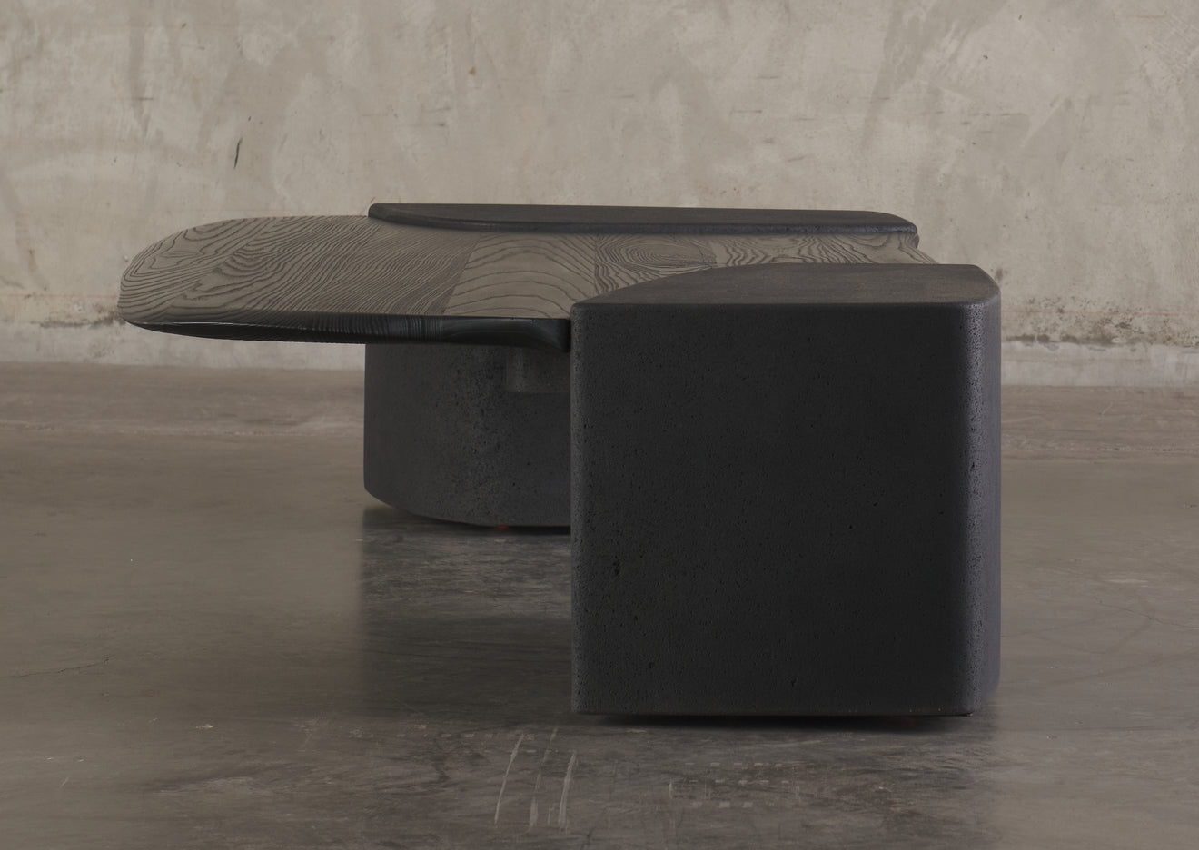ERNESTO AZCARATE BASALT AND WOOD COFFEE TABLE