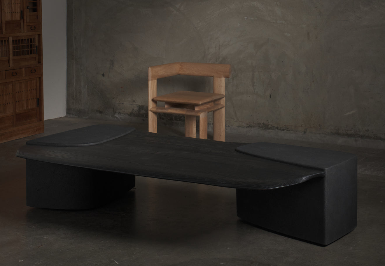 ERNESTO AZCARATE BASALT AND WOOD COFFEE TABLE