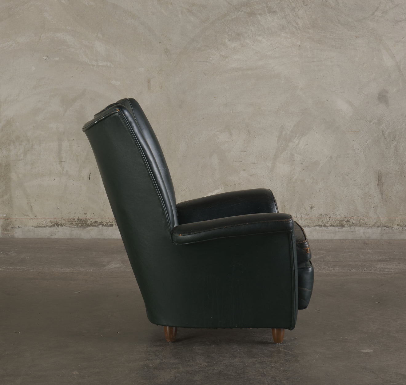 GREEN ROCKING WING BACK LOUNGE CHAIR, MID 20TH C