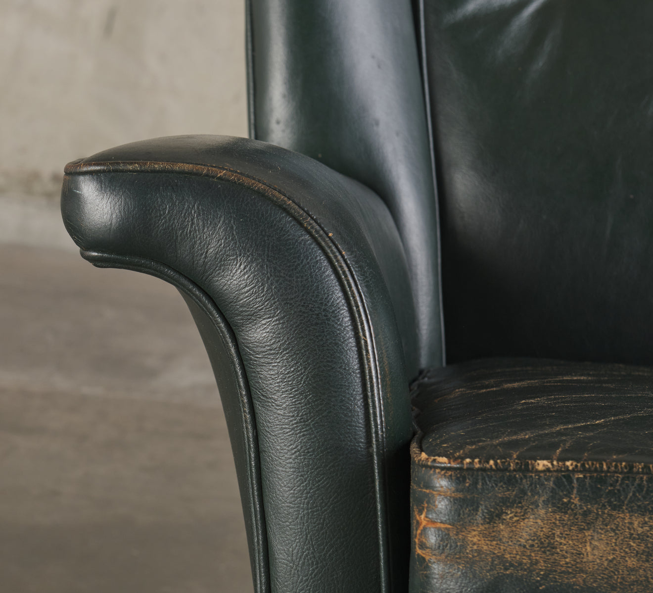 GREEN ROCKING WING BACK LOUNGE CHAIR, MID 20TH C