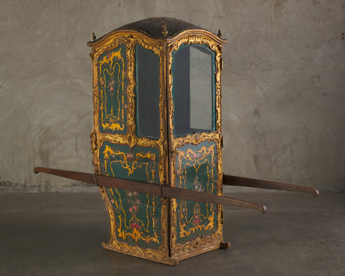 ITALIAN CARVED AND GILDED SEDAN CHAIR WITH ORIGINAL INTERIOR AND GLASS