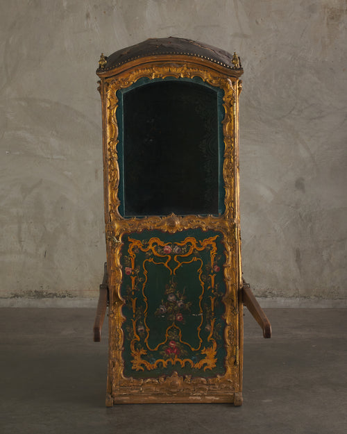 ITALIAN CARVED AND GILDED SEDAN CHAIR WITH ORIGINAL INTERIOR AND GLASS