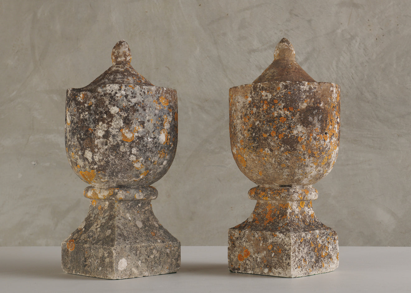 PAIR OF ANTIQUE CARVED STONE ORNAMENTAL GARDEN URNS, 19th C