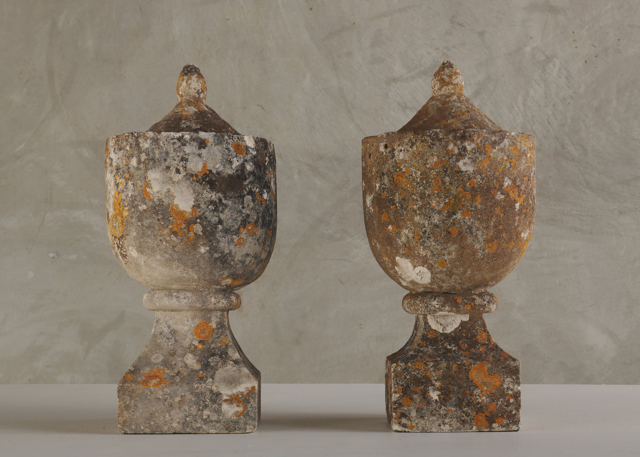 PAIR OF ANTIQUE CARVED STONE ORNAMENTAL GARDEN URNS, 19th C