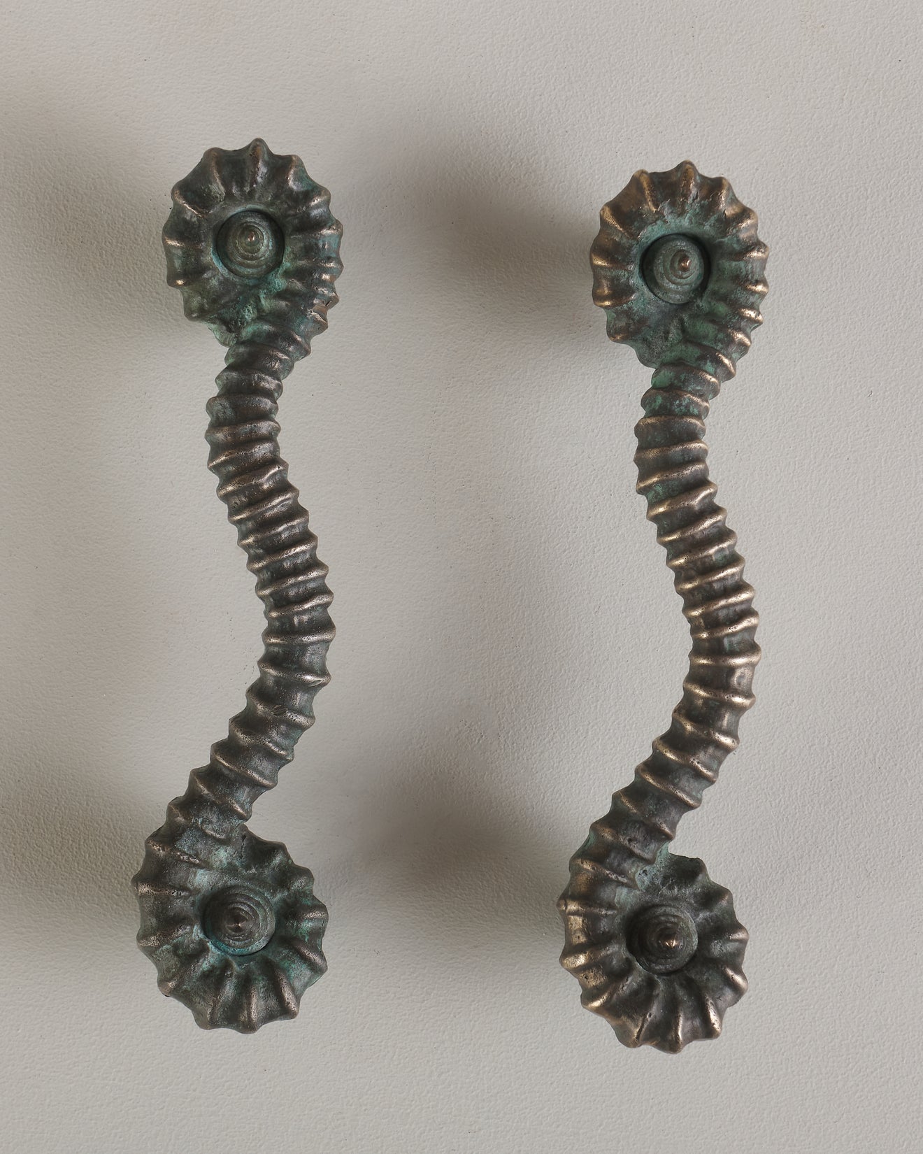 PAIR OF BRONZE AMMONITE HANDLES