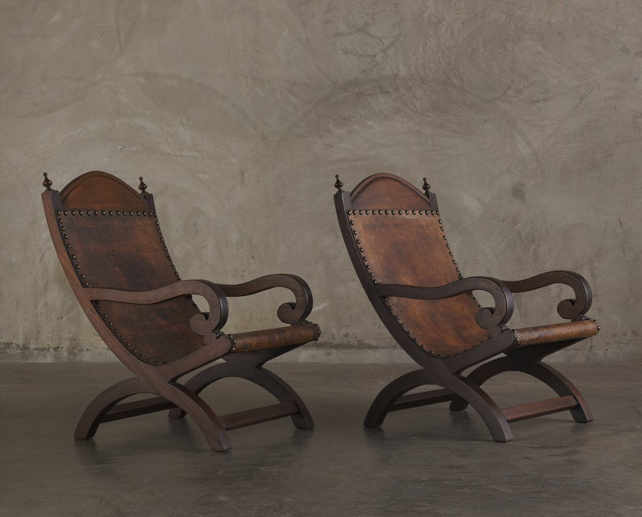 PAIR OF BUTAQUE ARM CHAIRS