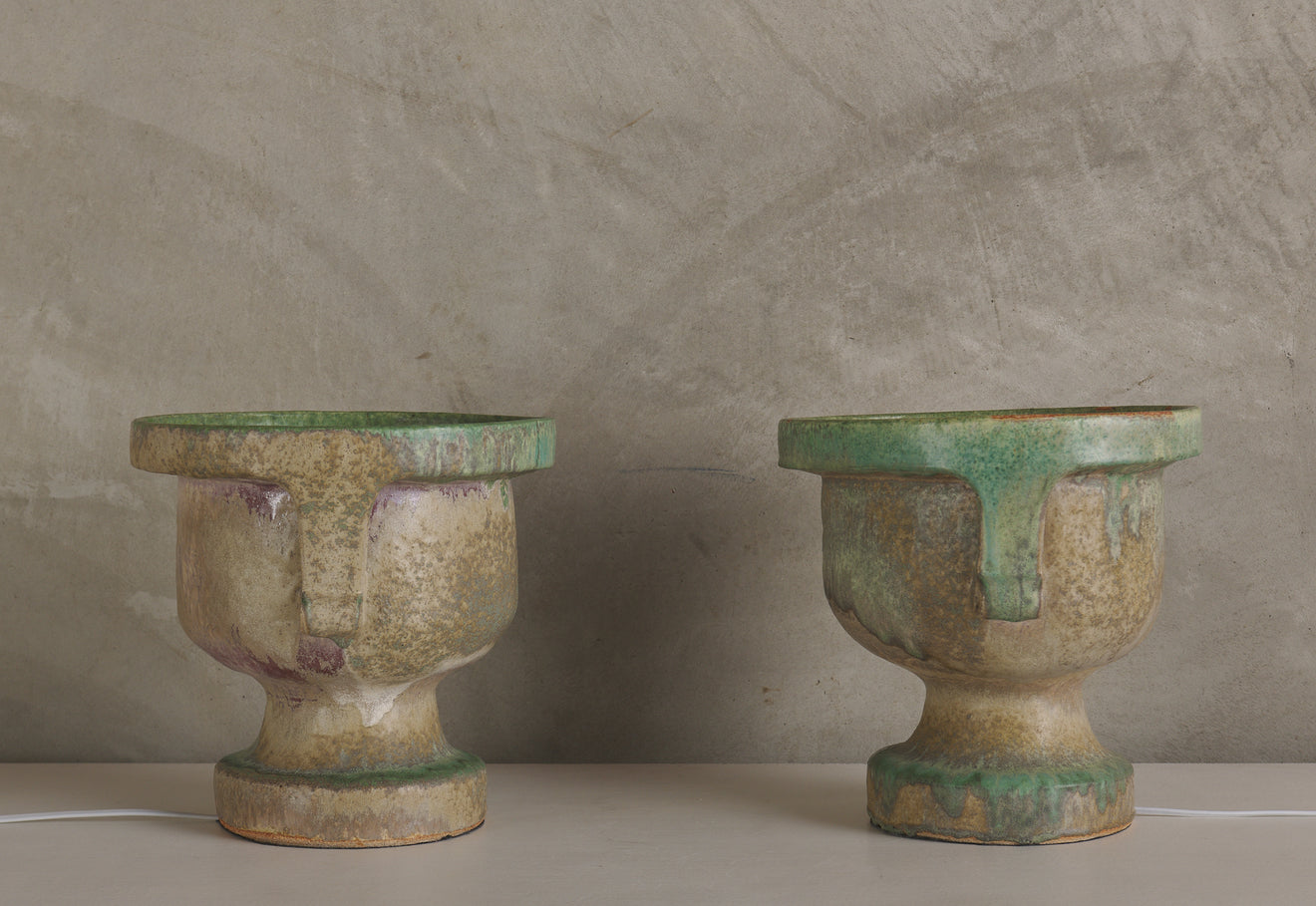 PAIR OF CHRIS BROCK EAST SIDE GREEN CERAMIC TABLE TORCHIERES, 30'S STYLE