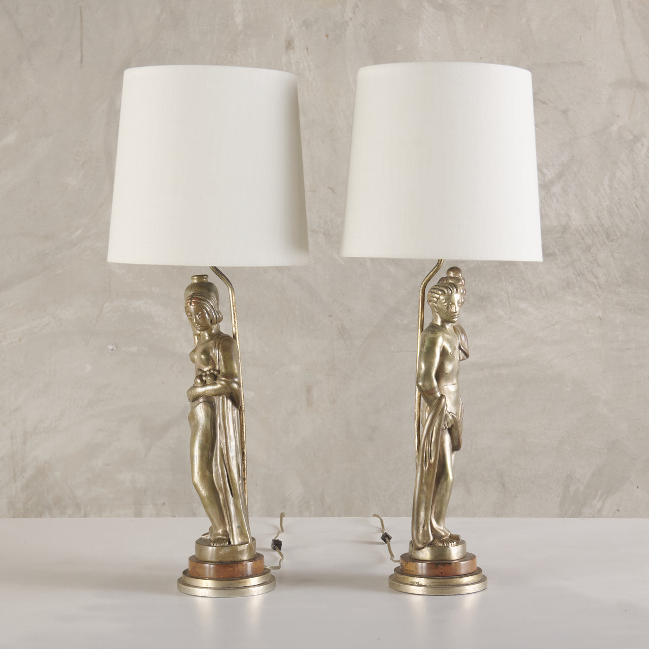 PAIR OF ART DECO SILVERED BRASS FIGURAL LAMPS, c1920