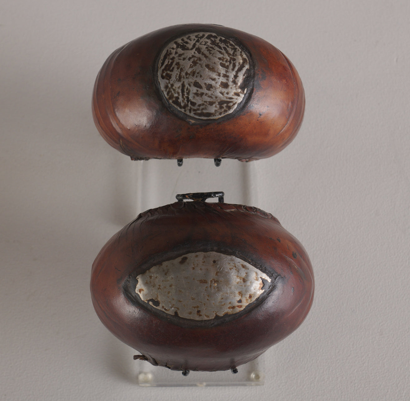 PAIR OF LEATHER MOUNTED BENIN CUFF BRACELETS, AFRICA, 20TH C