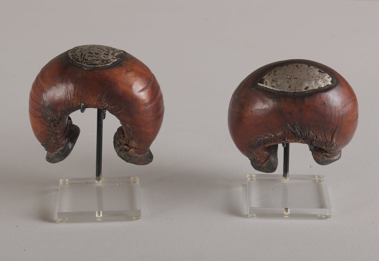 PAIR OF LEATHER MOUNTED BENIN CUFF BRACELETS, AFRICA, 20TH C