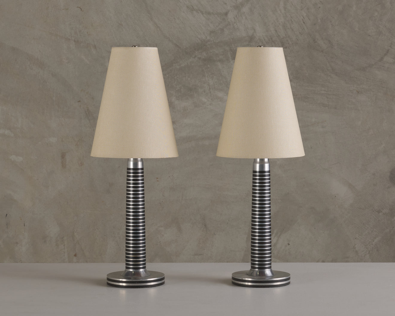 PAIR OF MACHINE AGE ALUMINUM LAMPS