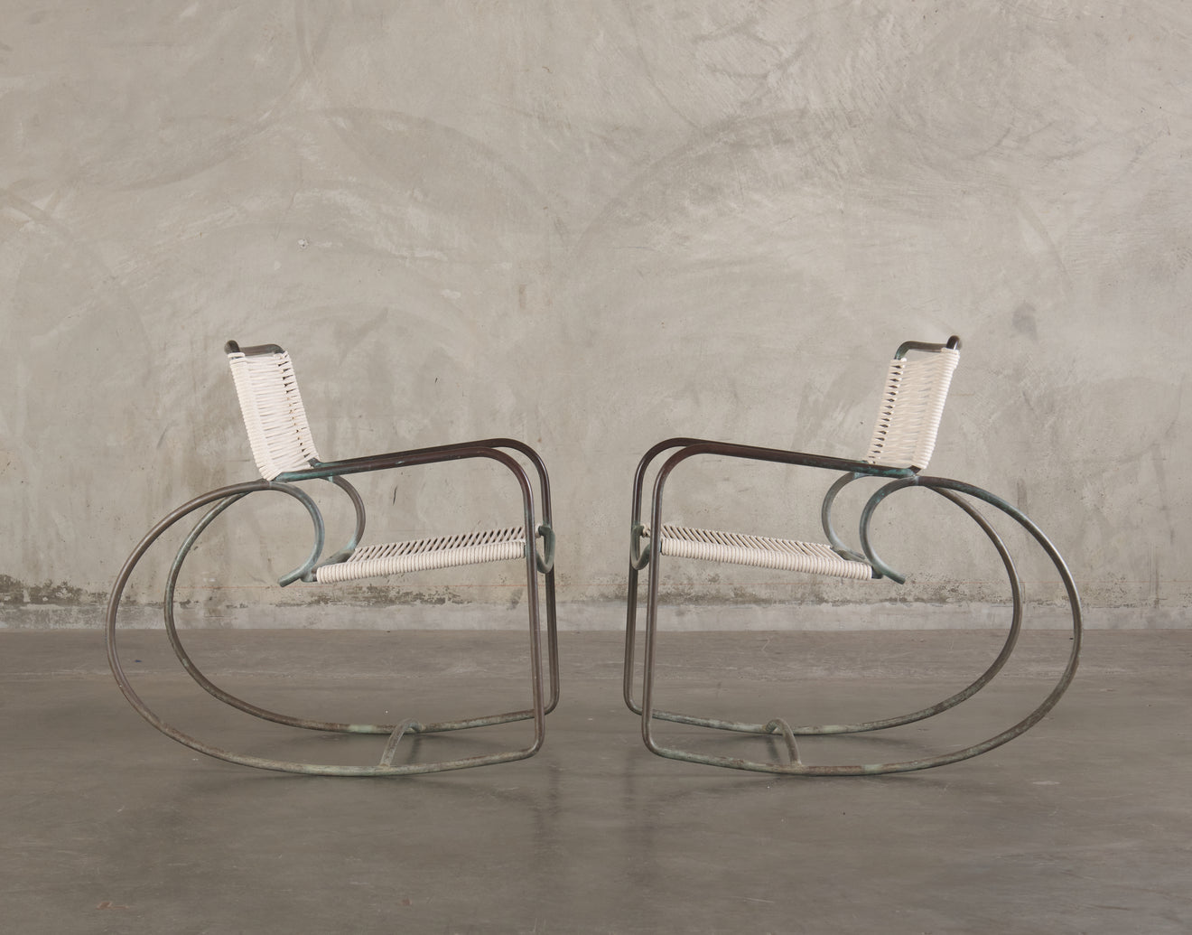 PAIR OF WALTER LAMB FOR BROWN JORDAN ROCKING ARM CHAIRS, 1950's