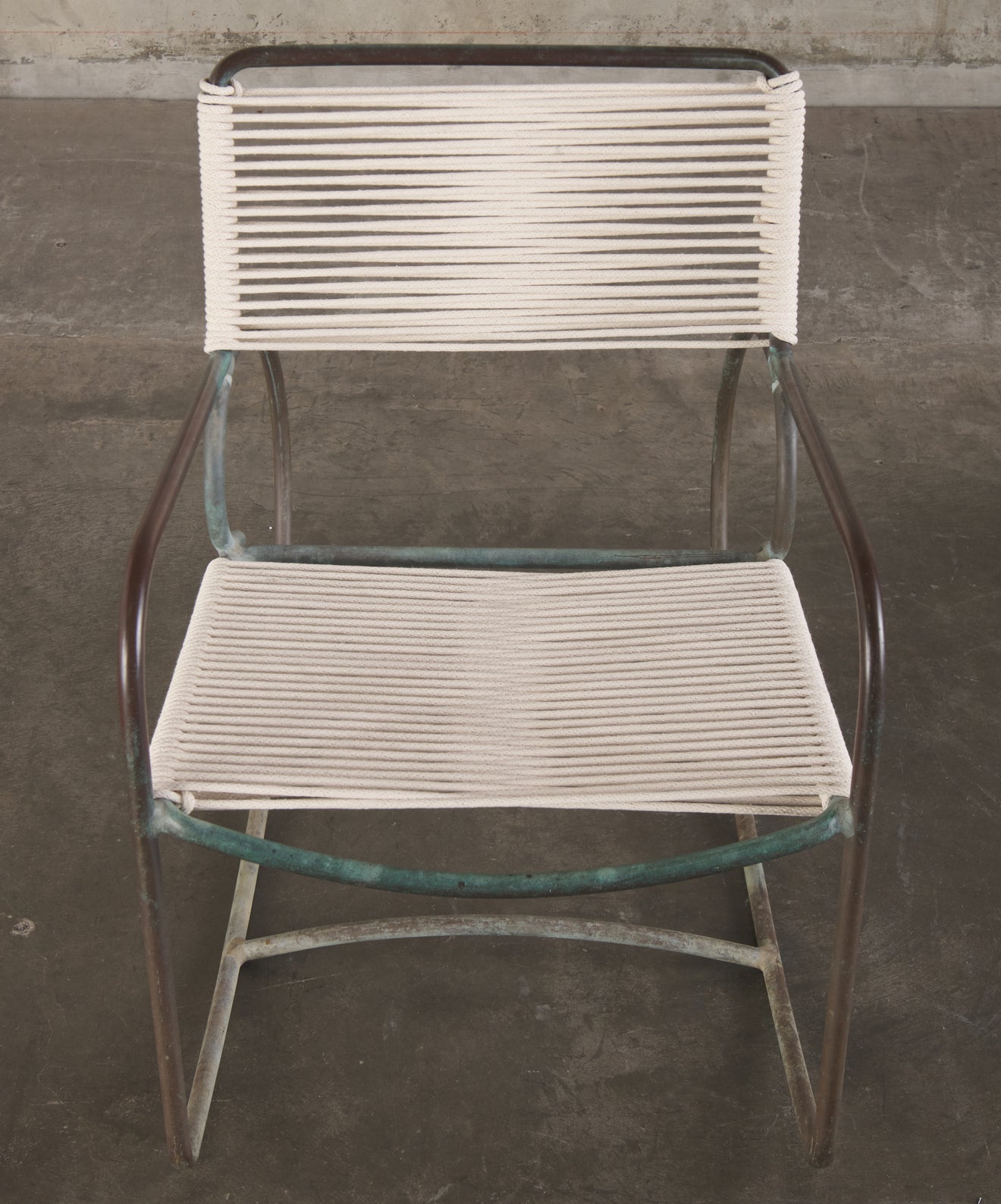 PAIR OF WALTER LAMB FOR BROWN JORDAN ROCKING ARM CHAIRS, 1950's
