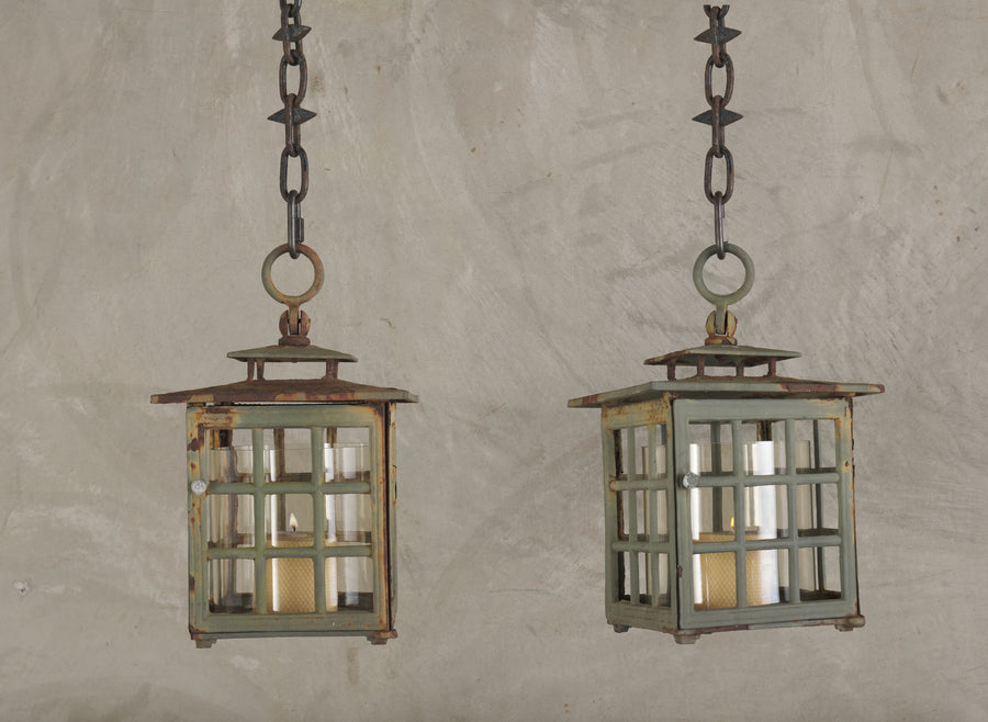 PAIR OF CAST IRON AND GLASS OUTDOOR LANTERNS, 1920'S