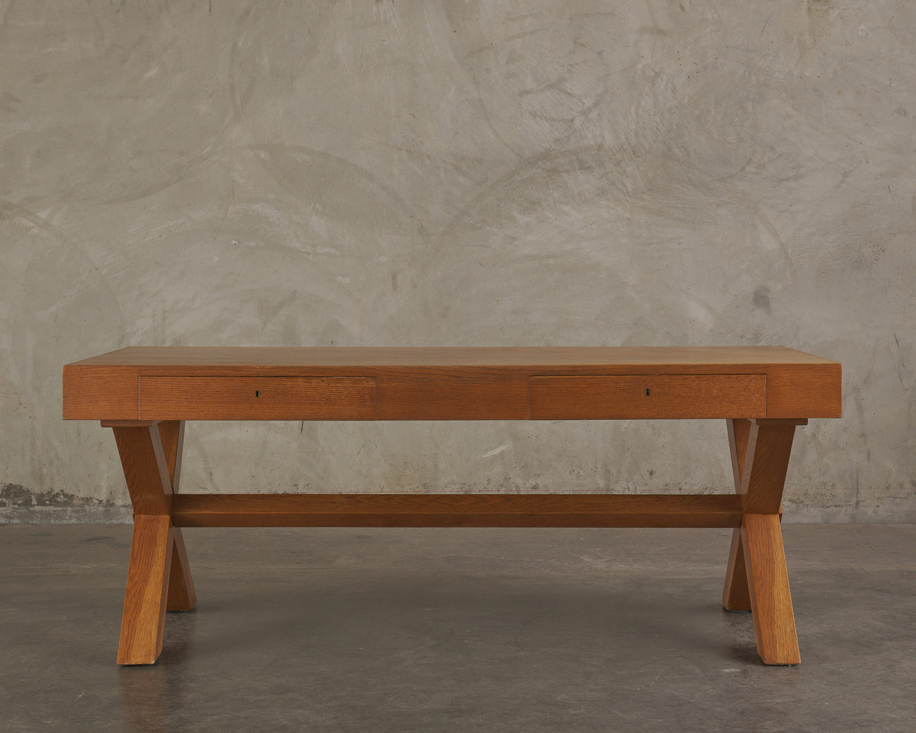 TWO DRAWER OAK DESK IN THE MANNER OF ROBSJOHN GIBBINGS