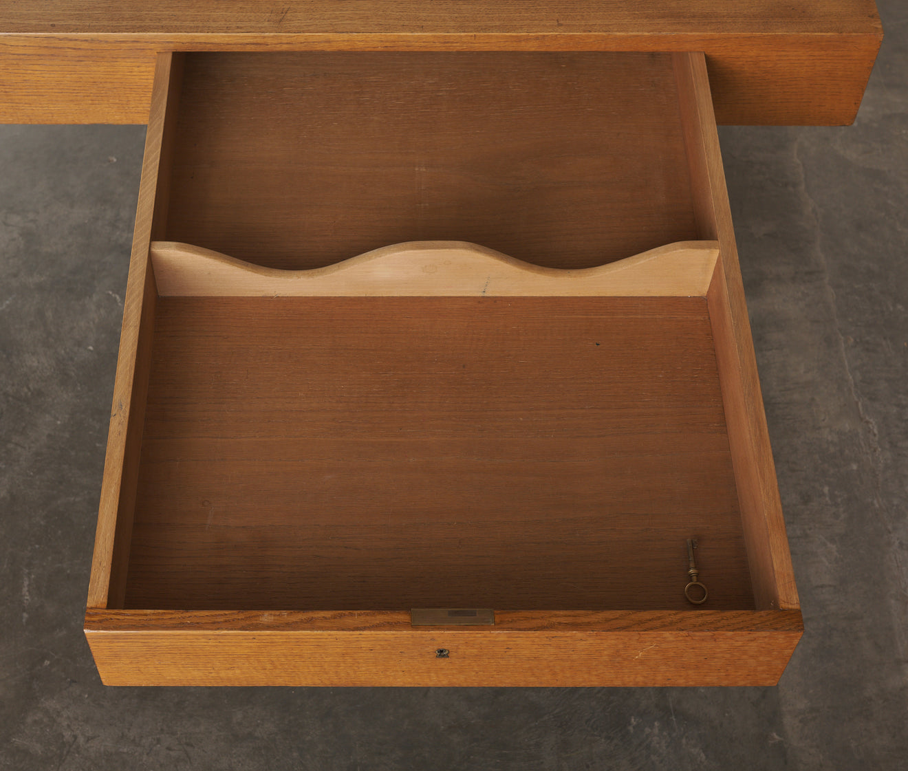 TWO DRAWER OAK DESK IN THE MANNER OF ROBSJOHN GIBBINGS