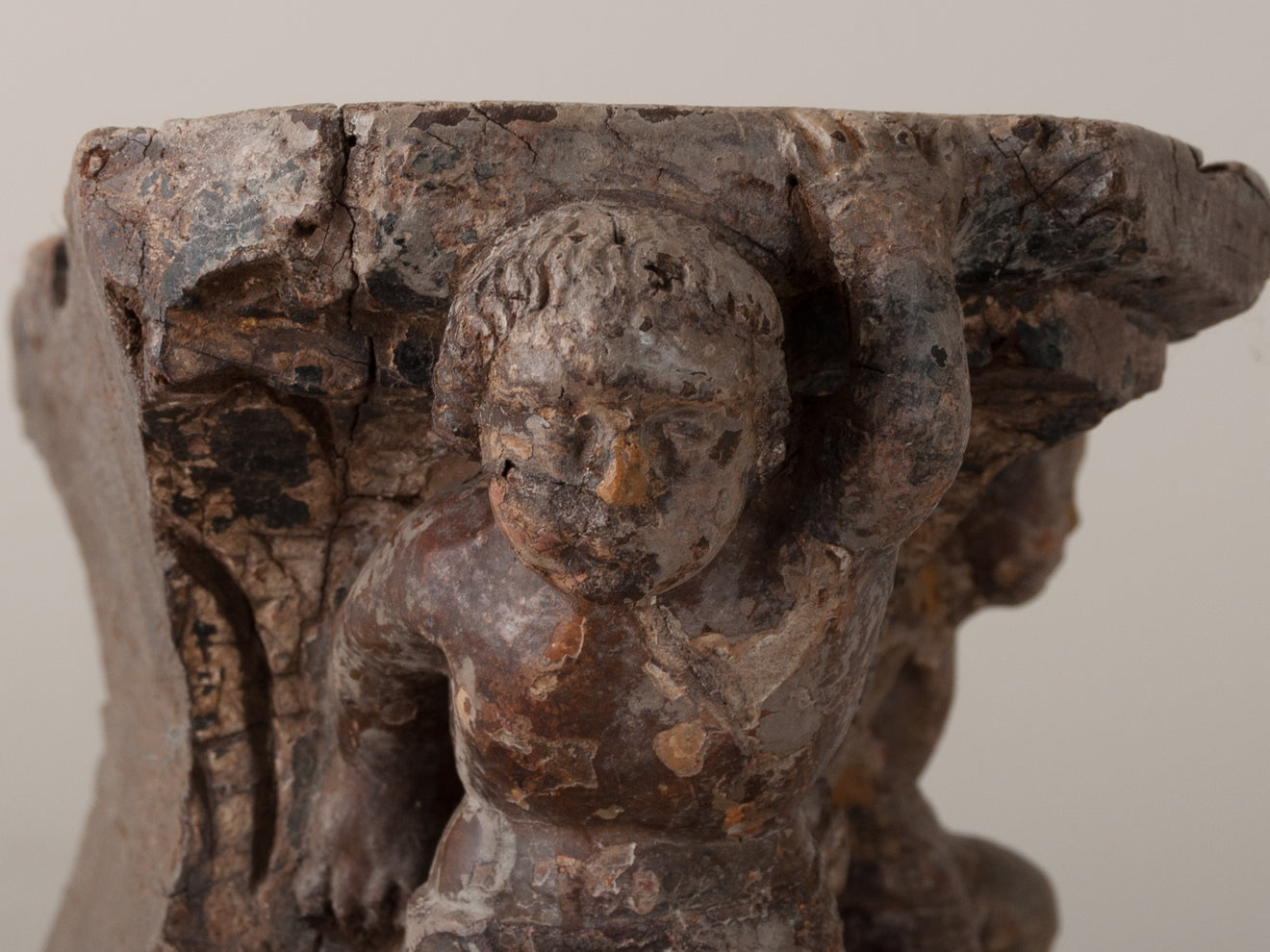 PEDESTAL WITH CARVED PUTTI
